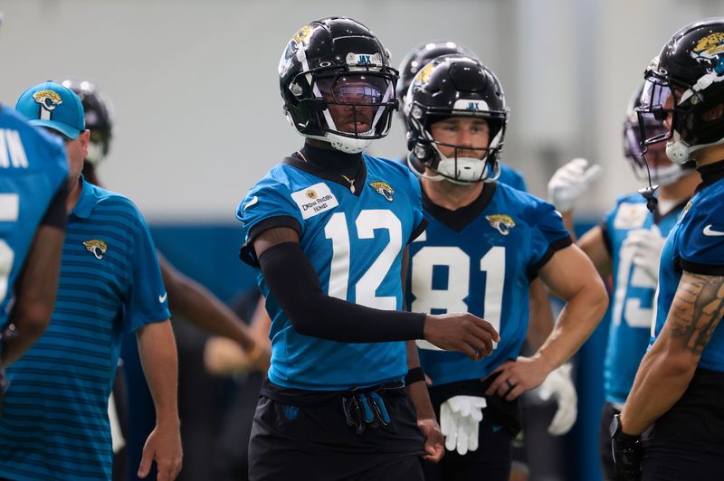 Jacksonville Jaguars wide receiver Travis Hunter (12) looks on during the 10th organized team activity at Miller Electric Center Wednesday, June 4, 2025 in Jacksonville, Fla. [Corey Perrine/Florida Times-Union]