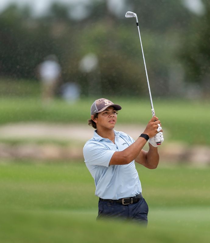 Charlie Woods hits out of a fairway bunker during the first round of the108th Amateur Championship at BallenIsles Country Club on June 5, 2025, in Palm Beach Gardens, Florida.