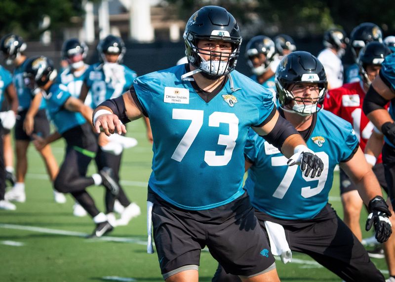 Jacksonville Jaguars center Robert Hainsey (73) warms up with Jacksonville Jaguars center Luke Fortner (79) during the seventh organized team activity at the Miller Electric Center in Jacksonville, Fla. Monday, June 2, 2025. [Doug Engle/Florida Times-Union]
