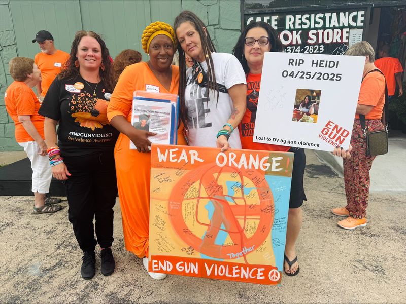 Volunteers with Moms Demand Action — Rhonda Phillips, from left, Veronica Glover, Latasha Hobbs and Kathryn Belina — participate in an event for National Gun Violence Awareness Day on June 6 in Jacksonville. Moms Demand Action is a gun reform advocacy group.