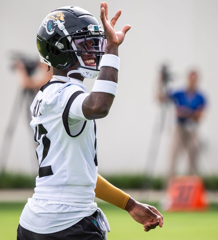 Jacksonville Jaguars wide receiver Travis Hunter (12) waves to someone in the stands during the Jacksonville Jaguars’ mandatory minicamp Tuesday June 10, 2025 at the Miller Electric Center in Jacksonville, Fla. [Doug Engle/Florida Times-Union]