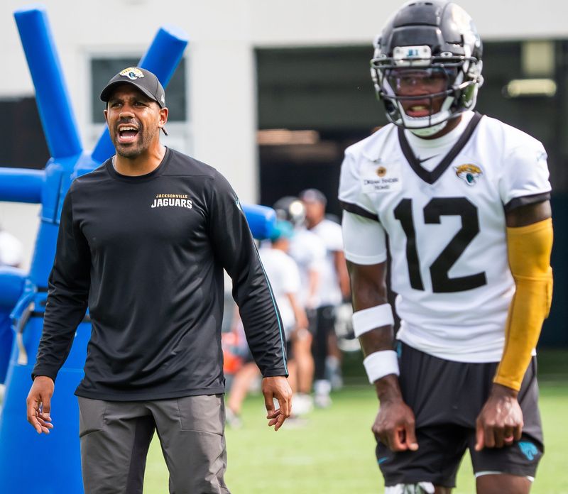 Jacksonville Jaguars defensive backs coach Anthony Perkins barks out orders as Jacksonville Jaguars wide receiver Travis Hunter (12) prepares to run a drill during the Jacksonville Jaguars’ mandatory minicamp Tuesday June 10, 2025 at the Miller Electric Center in Jacksonville, Fla. [Doug Engle/Florida Times-Union]