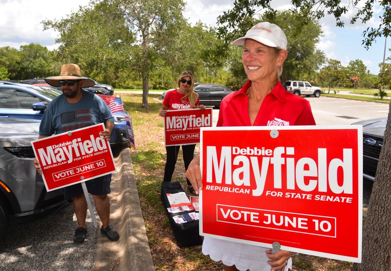 Debbie Mayfield, at right, was out at lunchtime on June 10, waving to voters and thanking them for voting at Wickham Park in Melbourne. With Mayfield were PK Kapur and Marisa Kahn.