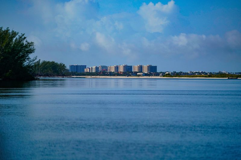 Condos on Marco Island are visible from the Calhoun Channel between Little Marco Island and Cannon Island in Naples, Fla., on Thursday, June 12, 2025.