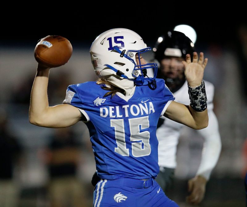 Deltona QB Jeremiah Hancock looks to pass during a game with New Smyrna Beach at Deltona High School, Friday, Oct. 18, 2024.