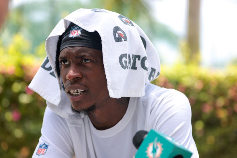 Jun 10, 2025; Miami, FL, USA; Miami Dolphins cornerback Cam Smith (24) speaks to reporters after practicing during mandatory minicamp at Hard Rock Stadium. Mandatory Credit: Sam Navarro-Imagn Images