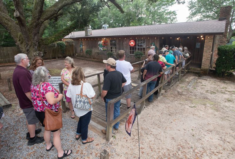 People line up to dine at Gator’s Seafood Restaurant as they celebrate their 50th anniversary in Milton on June 13, 2025.