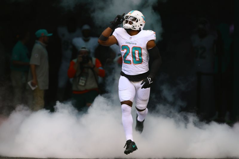 Sep 8, 2024; Miami Gardens, Florida, USA; Miami Dolphins linebacker Jordyn Brooks (20) runs onto the field before the game against the Jacksonville Jaguars at Hard Rock Stadium. Mandatory Credit: Sam Navarro-Imagn Images