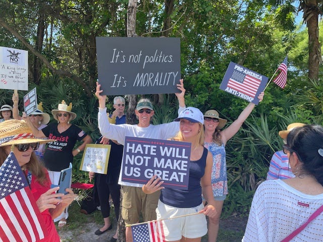 People attend the June 14, 2025 "No Kings" protest rally along PGA Boulevard in Palm Beach Gardens.