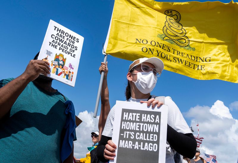 Protesters march across the Southern Blvd. bridge to get near President Trump's Mar-a-Lago home during a "No Kings Day" protest on June 14, 2025 in West Palm Beach, Florida.