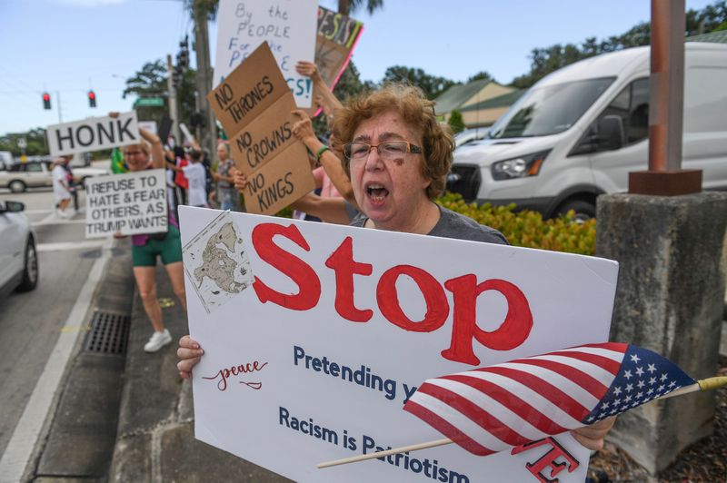 Anna Noyes, of Port St. Lucie, protests to passing traffic along Port St. Lucie Boulevard. The 'No Kings' protest in Port Lucie drew thousands to the intersection of St. Lucie and Airoso boulevards in front of Port St. Lucie City Hall between 4 and 6 p.m. June 14, 2025. The event was organized around the nation and in about 75 locations around Florida. It emphasized rejecting authoritarianism since President Donald Trump took office and that he is 'not a king,' as many people chanted.