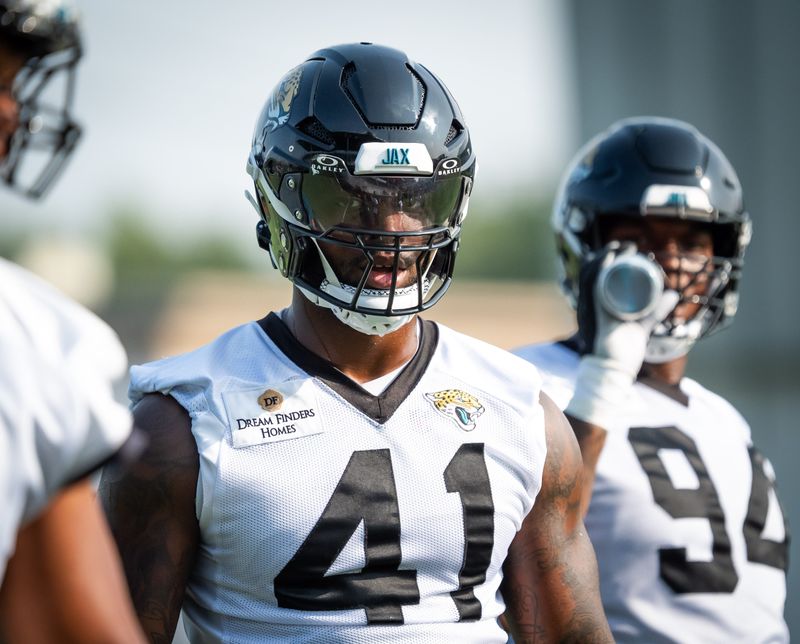 Jacksonville Jaguars defensive end Josh Hines-Allen (41) talks to a teammate while runing through drills during the seventh organized team activity at the Miller Electric Center in Jacksonville, Fla. Monday, June 2, 2025. [Doug Engle/Florida Times-Union]