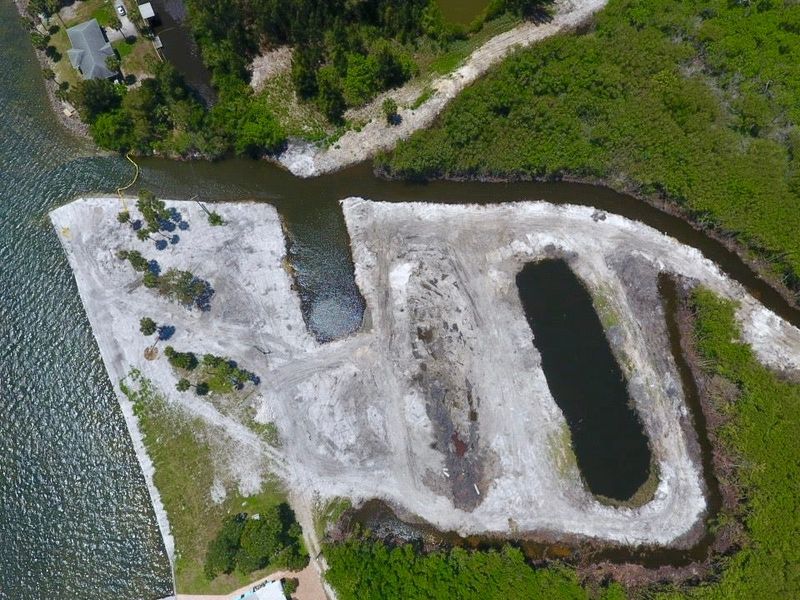 This drone image shows a 4.5-acre lot at 5200 93rd Lane in Sebastian June 13, 2025, that is mostly submerged environmentally sensitive lowlands. Mangrove trees were illegally removed and there was pollution of the Indian River Lagoon from the unpermitted clearing of the privately owned waterfront property, according to state Department of Environmental Protection and Indian River County officials.