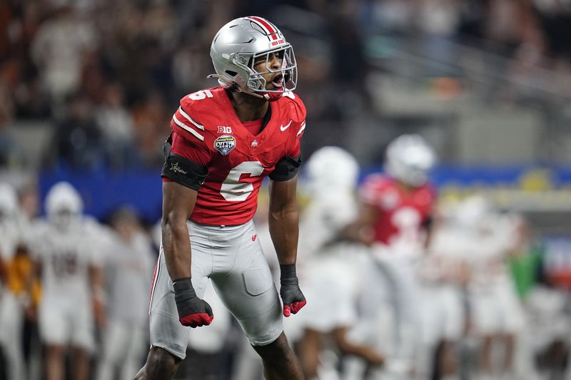 Ohio State Buckeyes safety Sonny Styles (6) celebrates a defensive stop during the first half of the Cotton Bowl Classic College Football Playoff semifinal game against the Texas Longhorns at AT&T Stadium in Arlington, Texas on Jan. 10, 2025.