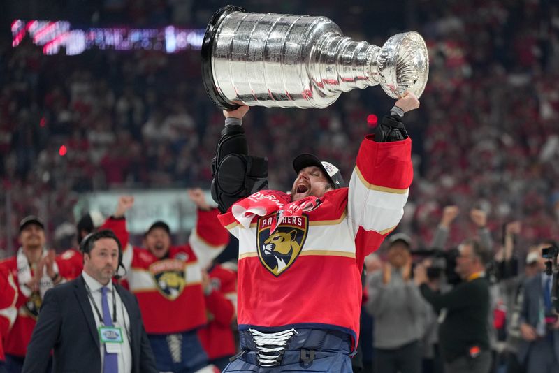 Game 6: Florida Panthers goaltender Sergei Bobrovsky (72) hoists the Stanley Cup.