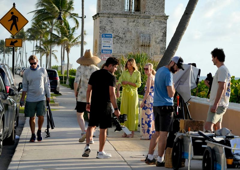 Rebl House Media prepares to photograph models wearing Tribal Fashion clothing near the Worth Avenue Clock Tower on June 18, 2025.