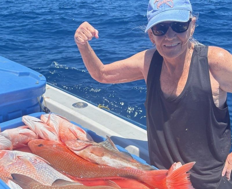 Patty Zurbrick with fresh catch of fish.