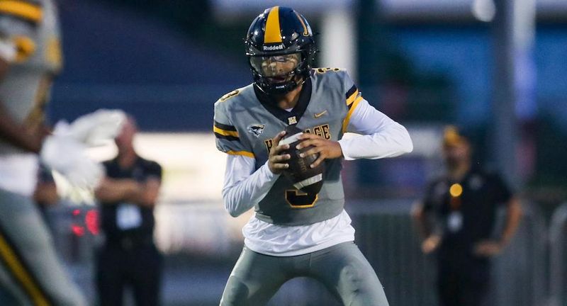 American Heritage Patriots quarterback Dia Bell (3) scrambles in the backfield during the first quarter of a game against the Naples Golden Eagles at Staver Field in Naples on Friday, Sept. 13, 2024.