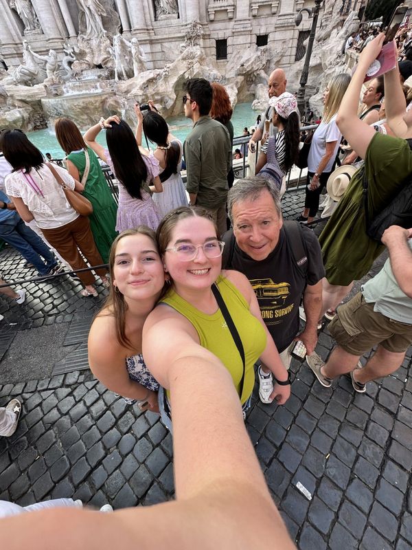 The crowds gathered around the Trevi Fountain in Rome - including (from left) Alexandra, Victoria and Nick Pugliese - mean long waits to stand in front of the famous landmark and toss your coin into the water.