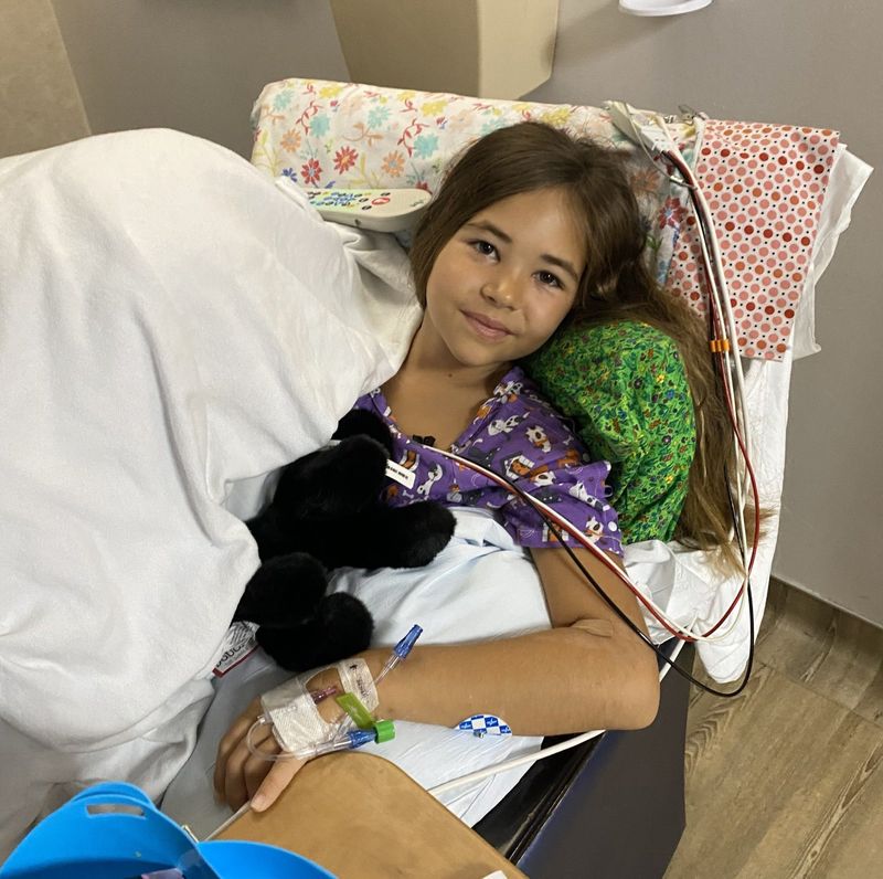 Shark-bite victim Leah Lendel, 9, of Bradenton poses for a photo at Tampa General Hospital, where doctors reattached her hand after she was attacked June 11 off the coast of Boca Grande.