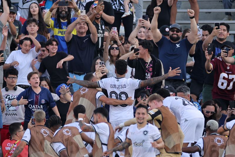 Botafogo's Igor Jesus celebrates scoring a goal with teammates.
