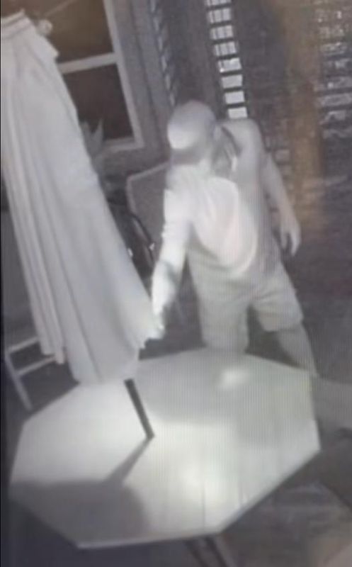 The Fernandina Beach Police Department provided security video showing a man setting fire to a patio umbrella at Sliders Seaside Grill early June 20, 2025. This is an image from the video.