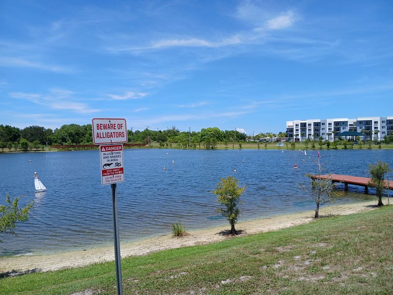 A view of the lake at Poppleton Creek Park on June 20, 2025, looking northeast. The east side of the park could be affected by an extension of Willoughby Boulevard, if that extension is built.