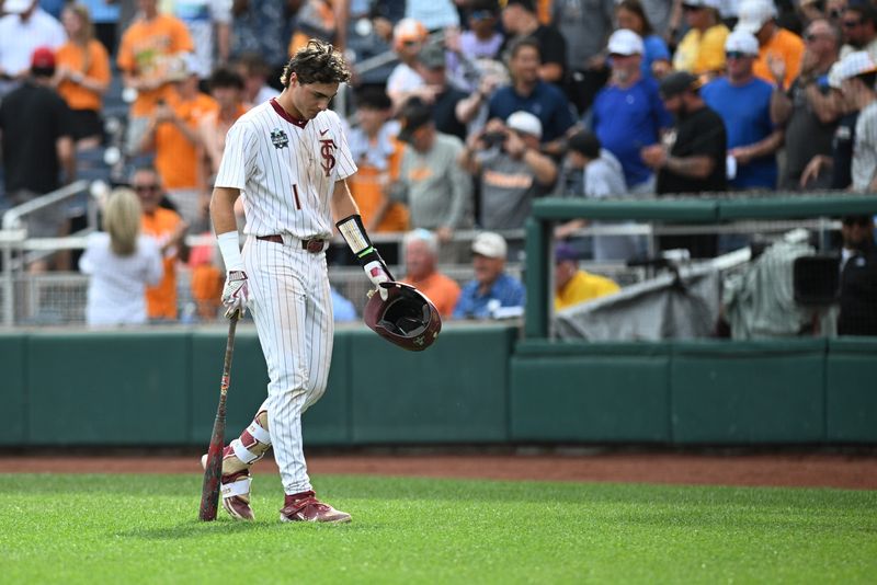 Jun 19, 2024; Omaha, NE, USA; Florida State Seminoles shortstop Alex Lodise (1) walks off the field after the loss against the Florida State Seminoles at Charles Schwab Field Omaha. Mandatory Credit: Steven Branscombe-USA TODAY Sports