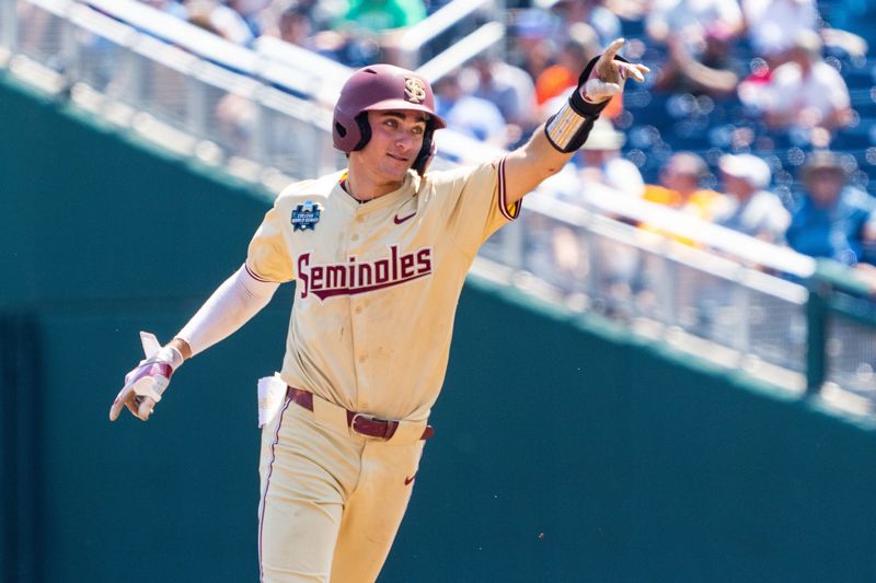 Jun 16, 2024; Omaha, NE, USA; Florida State Seminoles shortstop Alex Lodise (1) celebrates after hitting a home run against the Virginia Cavaliers during the sixth inning at Charles Schwab Field Omaha. Mandatory Credit: Dylan Widger-USA TODAY Sports