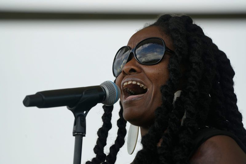 Melinda “Blou Note” Daniel sings the black national anthem during the annual Juneteenth Community Festival in Fort Myers at the Stars Complex on Saturday, June 21, 2025. The celebration, presented by the Lee County Black History Society, included vendors, live entertainment, food trucks, a Kids’ Zone, a deejay, fireworks and more.
