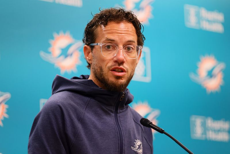 Aug 15, 2024; Miami Gardens, FL, USA; Miami Dolphins head coach Mike McDaniel talks to reporters before joint practice with the Washington Commanders at Baptist Health Training Complex. Mandatory Credit: Sam Navarro-USA TODAY Sports