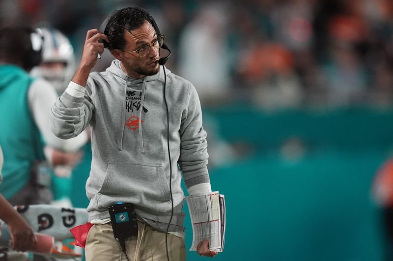 Dec 22, 2024; Miami Gardens, Florida, USA; Miami Dolphins head coach Mike McDaniel walks down the sideline during second half between the Miami Dolphins and the San Francisco 49ers at Hard Rock Stadium. Mandatory Credit: Jasen Vinlove-Imagn Images