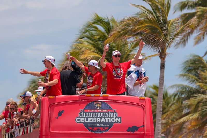Jun 22, 2025; Fort Lauderdale, Florida, UNITED STATES; Florida Panthers defenseman Niko Mikkola (77) celebrates during the Stanley Cup championship parade and rally. Mandatory Credit: Sam Navarro-Imagn Images
