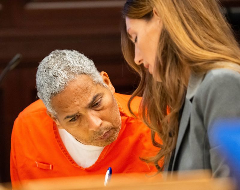 Death row inmate Michael Bernard Bell looks over a document with defense attorney Rachel Roebuck during his June 23, 2025, evidentiary hearing in the Duval County Courthouse. Bell is scheduled to be executed on July 15 for two murders in Jacksonville in 1993. He also is convicted of three other murders.