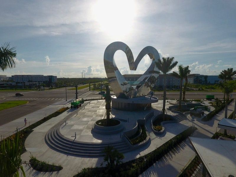 This drone image shows the Heart in the Park sculpture by artist JEFRË of Orlando, unveiled June 12, 2025. It is reportedly the world’s tallest heart sculpture and is within the Tradition development in Port St. Lucie. The 73-foot tall sculpture is at the intersection of Southwest Village Parkway and Southwest Discovery Way at The Shoppes at The Heart shopping plaza. The $7 million sculpture was commissioned and paid for by Mattamay Homes in 2021.