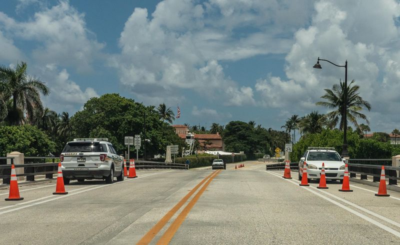 Two sheriff’s vehicles are parked on the small bridge on Southern Blvd. just west of Mar-a-Lago Monday afternoon June 23, 2025.