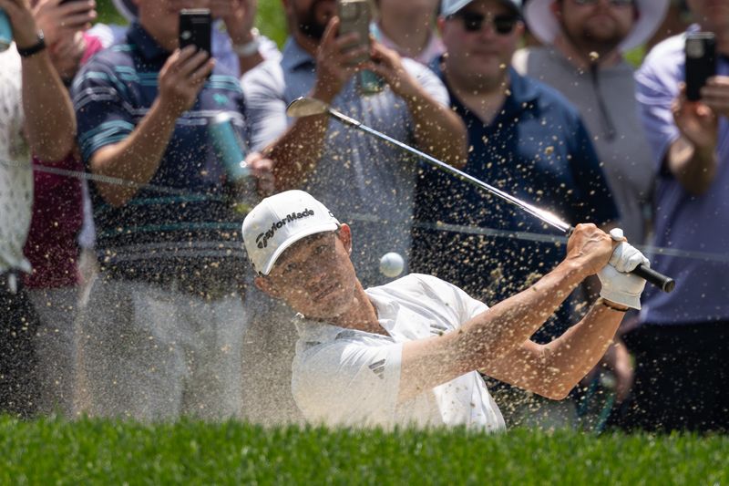 Jun 20, 2025; Cromwell, Connecticut, USA; Collin Morikawa plays a shot from a bunker on the seventh hole during the second round of the Travelers Championship golf tournament. Mandatory Credit: Bill Streicher-Imagn Images