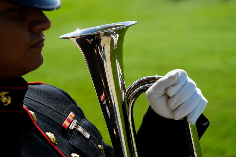 Marine Cpl. H. Lopez-Diaz waiting to play "Taps." A veteran Marine who had no family members was laid to rest at the Sarasota National Cemetery, Tuesday morning, June 24, 2025. Marine veteran Larry Jake Willis, 82, received a burial with full military honors. Over 40 people, even though they didn't know him, attended the service that was provided by Sarasota's Sound Choice Cremation and North Port's AMVETS Post 312, (amvets312.org) gathered for a final salute. For more information and events at Sarasota's National Cemetery visit https://bit.ly/3HSpP3O.