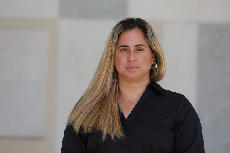 Katherine Cardonet, a newly naturalized citizen, celebrates outside of the Wilkie D. Ferguson Federal Courthouse in Miami on May 16, 2025.