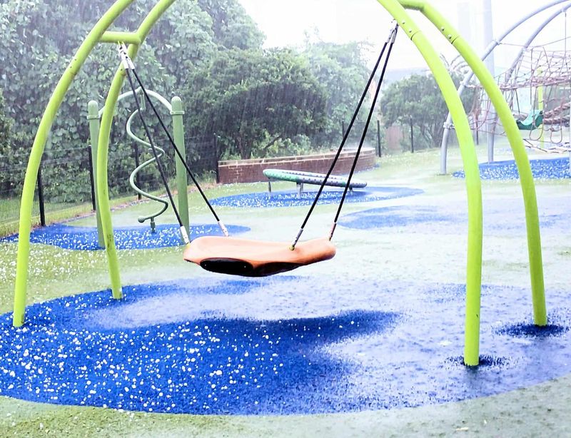 Hail on the ground at the Railroad Square playground on June 25, 2025.