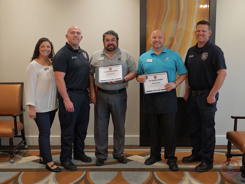 Ralph Portillo and Jimmy Montanez received awards after saving the lives of two residents at the Vi at Bentley Village retirement community in Naples.