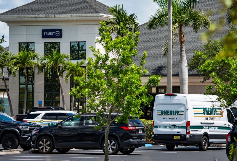 Lee County Sheriff's Office deputies investigate the scene at Truist bank in Fort Myers, Fla., on Thursday, June 26, 2025.