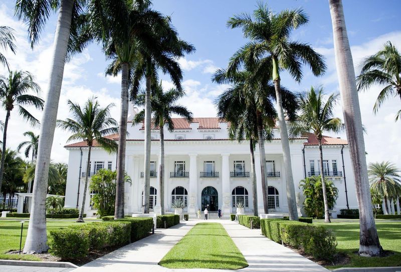 Palm Beach Police arrested a Boca Raton woman on charges including grand theft after they said she deposited a counterfeit $45,851.17 check drawn on one of the Flagler Museum's bank accounts to her own account. The museum at 1 Whitehall Way in Palm Beach is seen here.