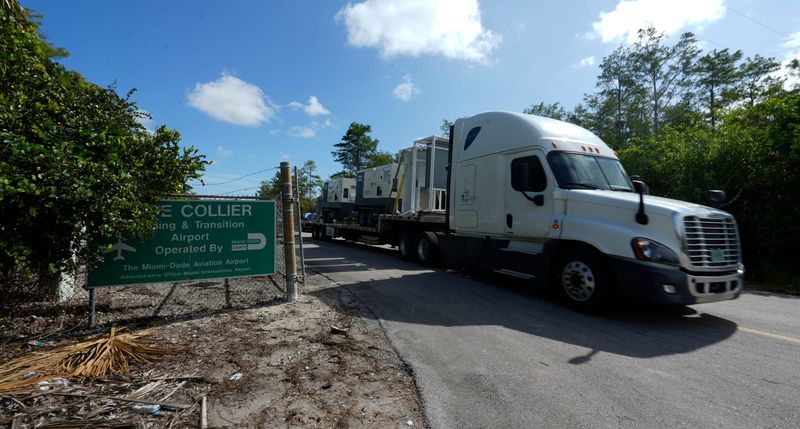 Delivery trucks kept coming in and out of the Dade-Collier Training and Transition Airport in the Big Cypress Wildlife Management Area Thursday, June 26, 2025. The airport location is being converted into a controversial migrant detention center currently being referred to as “Alligator Alcatraz.”