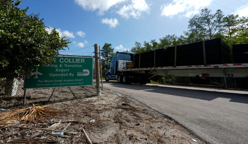 Portable fencing supplies are being delivered into the Dade-Collier Training and Transition Airport in the Big Cypress Wildlife Management Area Thursday, June 26, 2025. The airport location is being converted into a controversial migrant detention center currently being referred to as “Alligator Alcatraz.”