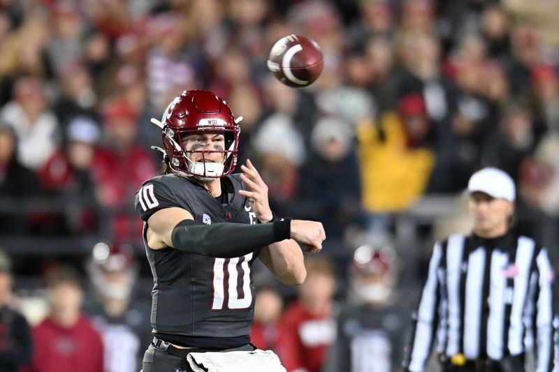 Nov 9, 2024; Pullman, Washington, USA; Washington State Cougars quarterback John Mateer (10) throws a pass against the Utah State Aggies in the first half at Gesa Field at Martin Stadium. Mandatory Credit: James Snook-Imagn Images
