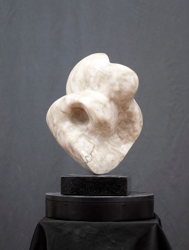 Sculptor Joel Shapese inherited an irregularly shaped alabaster stone from a friend whose partner passed away. The sculpture began as a face figure but after studying the stone, Shapses began carving a free-flowing abstract sculpture called “Introspection.”