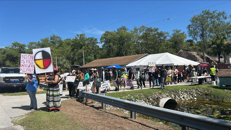 Protesters outside of Alligator Alcatraz in Ochopee, Florida, during President Donald Trump's visit to the facility Tuesday, July 1, 2025.