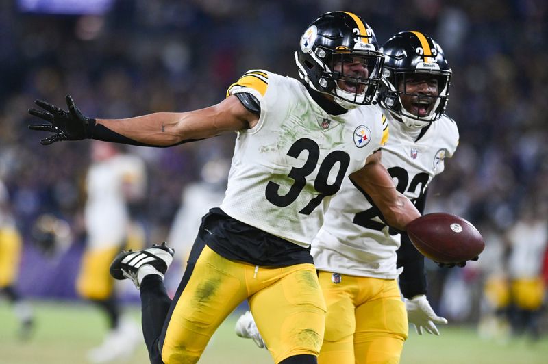 Jan 1, 2023; Baltimore, Maryland, USA; Pittsburgh Steelers safety Minkah Fitzpatrick (39) celebrates a fourth quarter interception of Baltimore Ravens quarterback Tyler Huntley (2) at M&T Bank Stadium. Mandatory Credit: Tommy Gilligan-USA TODAY Sports