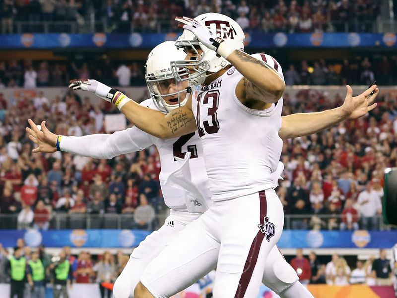 Jan 04, 2013; Arlington, TX, USA; Texas A&M Aggies quarterback Johnny Manziel (2) celebrates scoring a touchdown with wide receiver Mike Evans (13) during the first quarter against the Oklahoma Sooners in the 2013 Cotton Bowl at Cowboys Stadium. Mandatory Credit: Kevin Jairaj-USA TODAY Sports